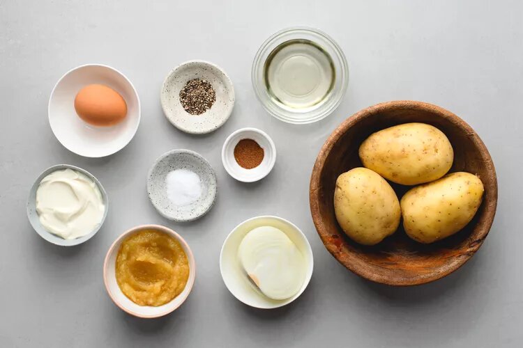 Ingredients to make German-style potato pancakes Kartoffelpuffer. (Source: thespruceeats.com)