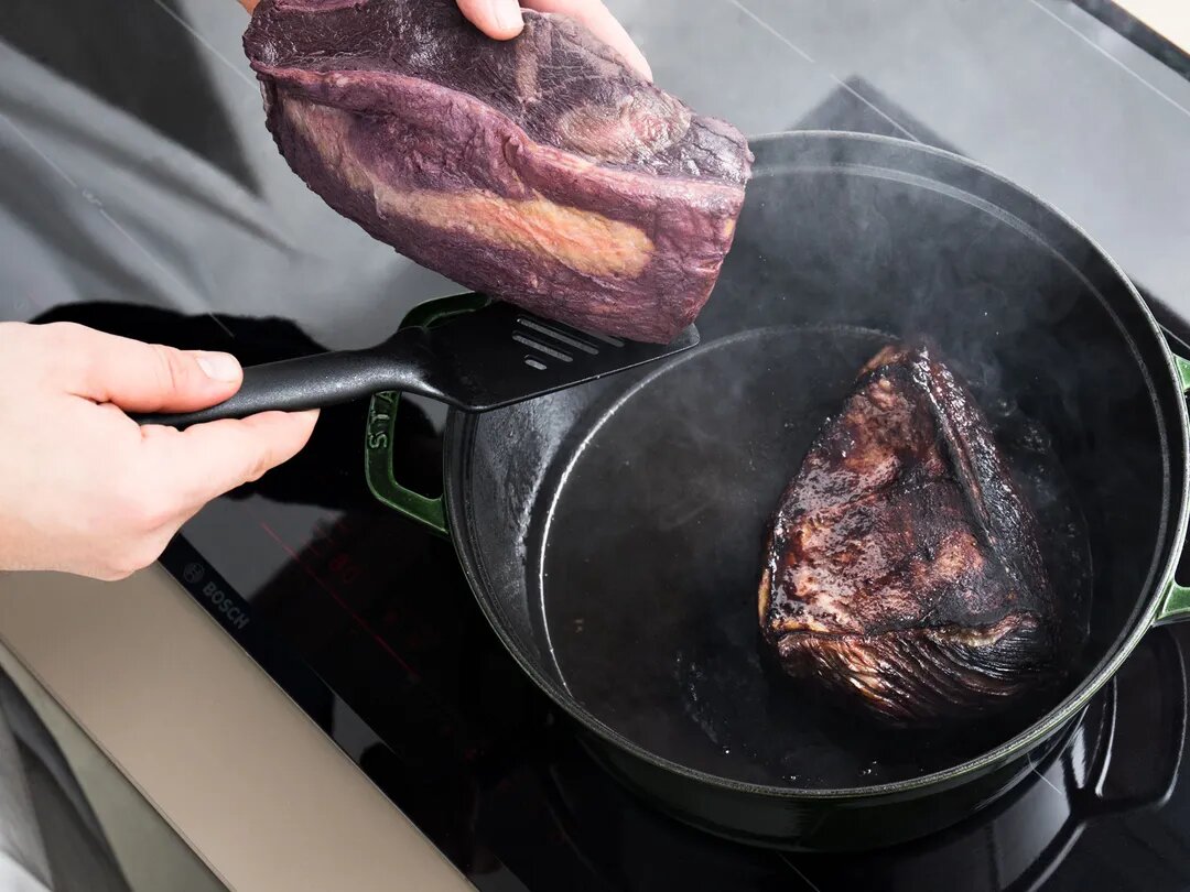 Searing the beef until golden brown before braising. (Source: kitchenstories.com)